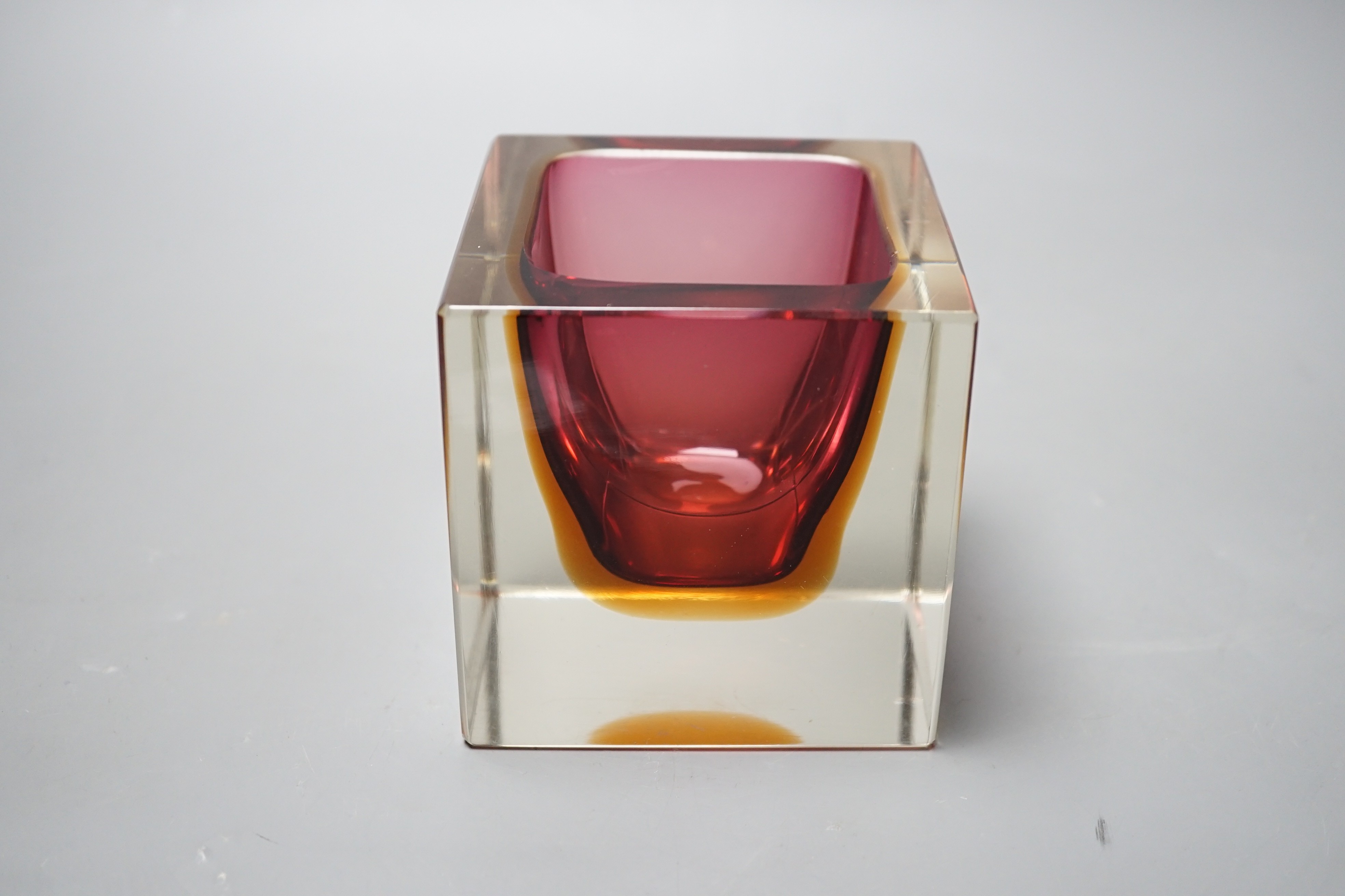 A Murano red, amber and clear cased glass cube vase, 9.5cm tall